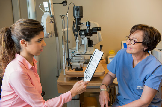 Female patient having eye examination in an optometrist clinic