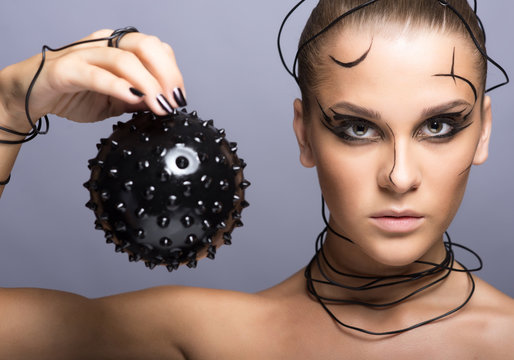 Beautiful cyber girl with black  prickly ball