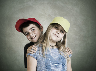 portrait of couple of children with caps current