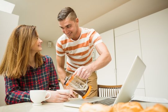 Cute couple having coffee together