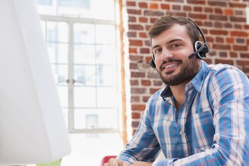 Casual businessman wearing a headset