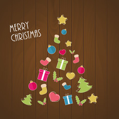 Christmas tree from ornaments on wooden background