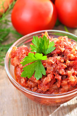 Tomato sauce in glass bowl, close up view