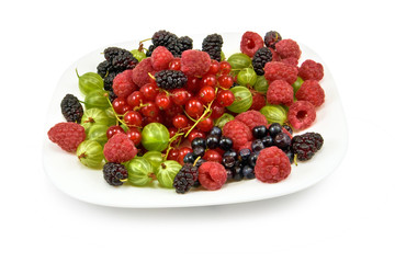 berries in a plate on a white background