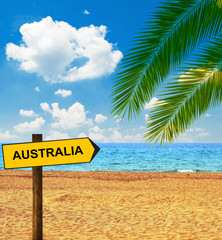 Naklejka premium Tropical beach and direction board saying AUSTRALIA