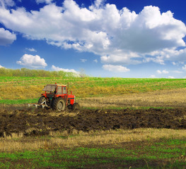 Fototapeta premium Tractor plowing