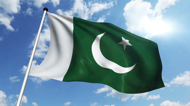 flag of Pakistan with fabric structure against a cloudy sky