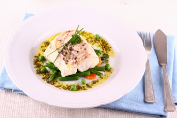 Cod fillet with green beans, peas, parsley, olive oil