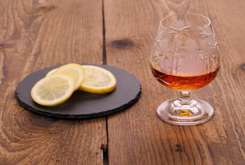 Luxury Cognac in decorated crystal glass and lemon