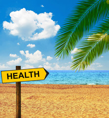 Naklejka premium Tropical beach and direction board saying HEALTH