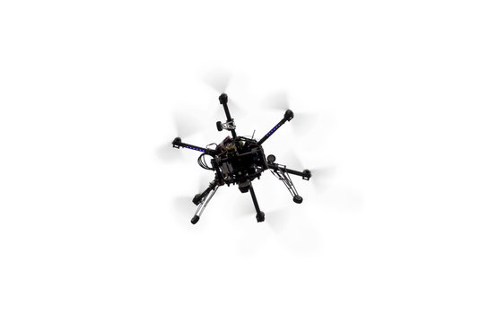 Flying drone on the light sky