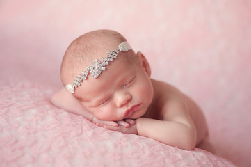 Newborn Baby Girl Wearing a Rhinestone Headband