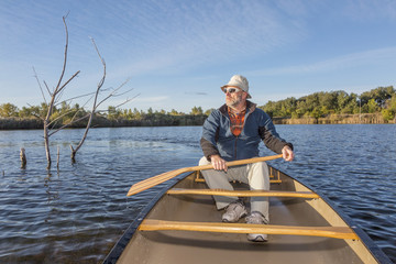 Fototapeta na wymiar paddling canoe on a lake