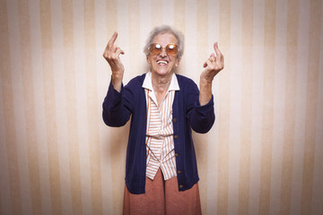 cool elder lady making middle finger sign