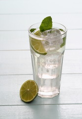 Hugo cocktail with lime, mint and ice cubes
