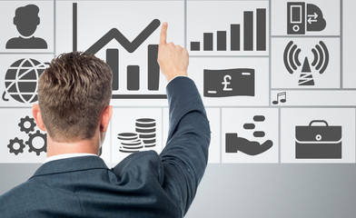 Successful businessman with business icons