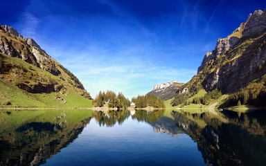 Naklejka na ściany i meble hilly landscape with a pond in the middle of Germany.