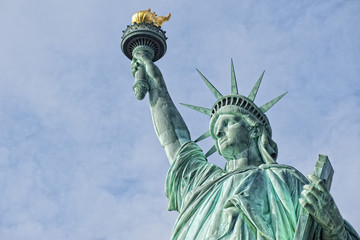Fototapeta na wymiar Statue Of Liberty in the deep blue sky
