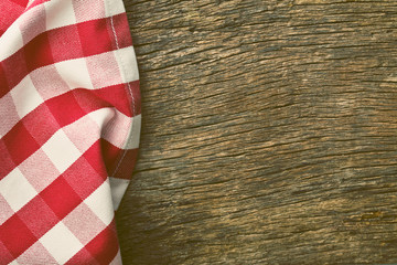 red tablecloth over old wooden table