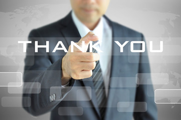 Businessman pointing to THANK YOU words on virtual screen
