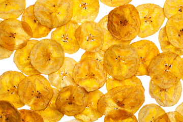Platano plantain chips on white background © mayakova