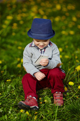 little modern boy with mobile phone