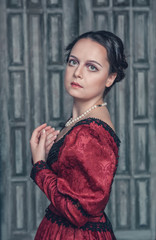 Beautiful medieval woman in red dress