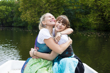 two woman in a rowing boat