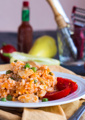 Risotto with chicken, peas and tomatoes, Italian cuisine