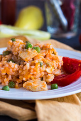 Risotto with chicken, peas and tomatoes, Italian cuisine