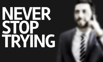 Business man with the text Never Stop Trying