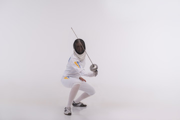 Young woman engaging in fencing