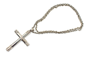 Fototapeta na wymiar Silver christian cross necklace isolated on white