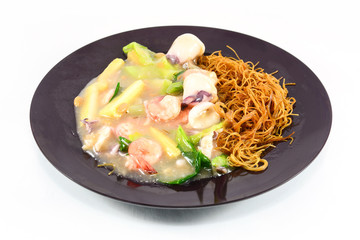 Fried noodle with shrimp ,squid and vegetable  isolate on white