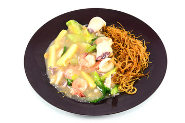 Fried noodle with shrimp ,squid and vegetable  isolate on white