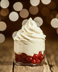 Frozen Yogurt on Glass Container with Red Cherries