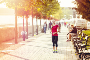 Woman running in city