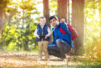 Father and son in the forest