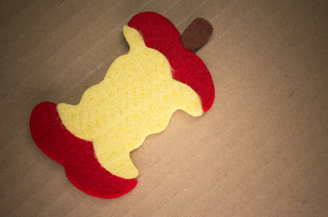 felt apple core on a cardboard background with copy space