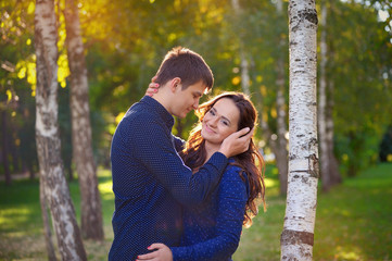 man and woman in the park in autumn