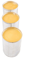 Condensed milk in tin can over white background 