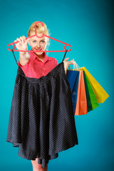 Pinup girl buying clothes black skirt. Sale retail