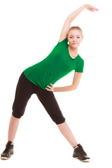 Fototapeta na wymiar Sport. Flexible fitness girl doing stretching exercise
