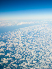 Naklejka na ściany i meble White cloudy sky. View from airplane flying in clouds.