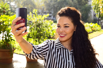 young woman taking a selfie.