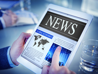 Man Reading the News on a Digital Tablet