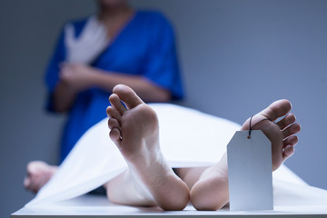 Worker of morgue during job