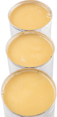 Condensed milk in tin can over white background 