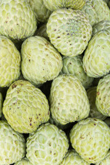 stack of custard apple in market