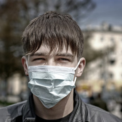 Teenager in Flu Mask